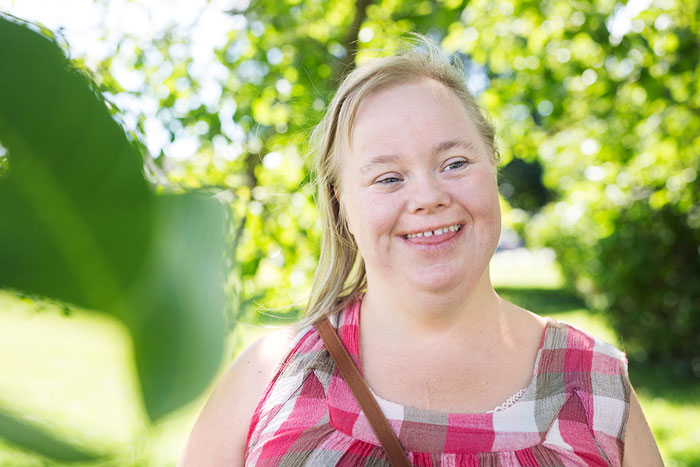 A woman with a down syndrome smiling