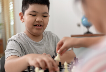 A boy playing chess