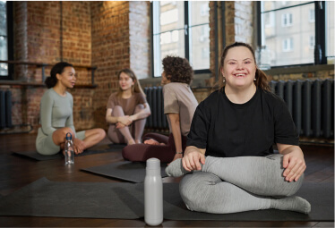 A woman practicing yoga with her arms raised